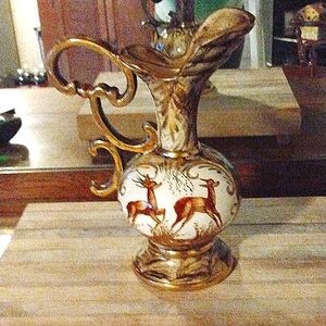 This is a Belgium 265 water pitcher mild color but covered in gold trimming